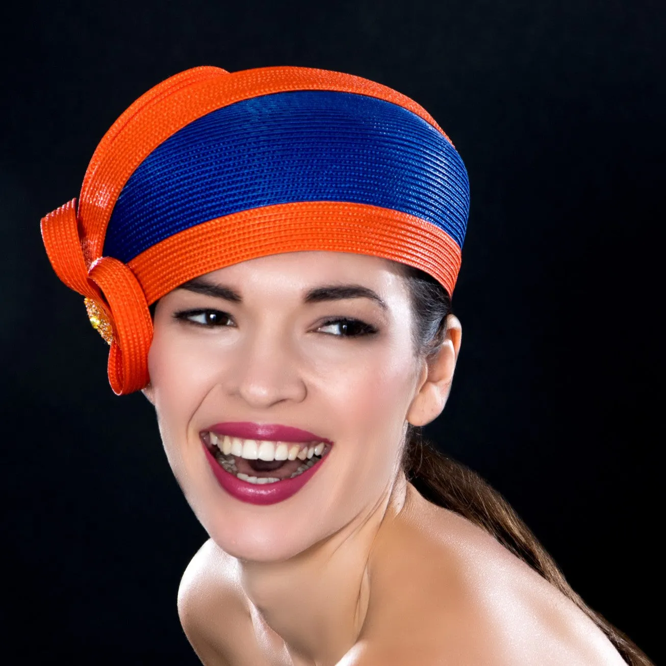 NA0047- Royal blue dress hat with orange trim design and applique